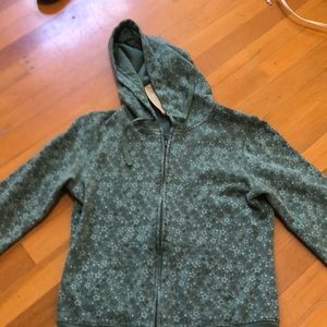 A green sweater with stars
